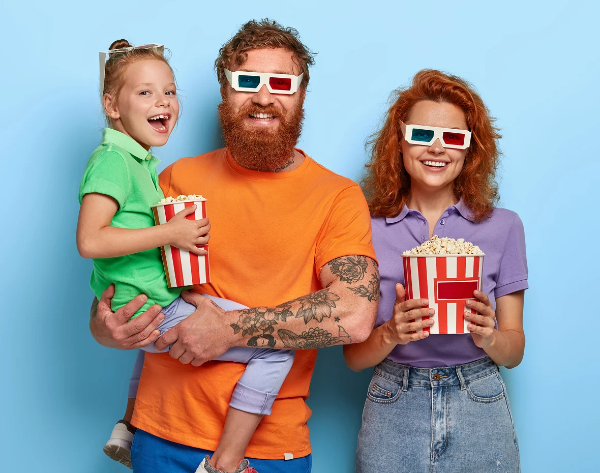 Family with 3d glasses and popcorn bowl
