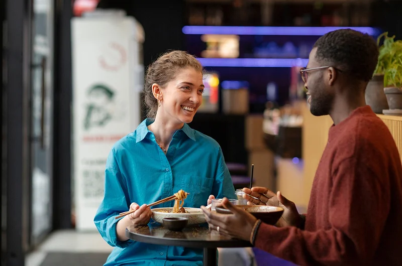 A couple eating and talking